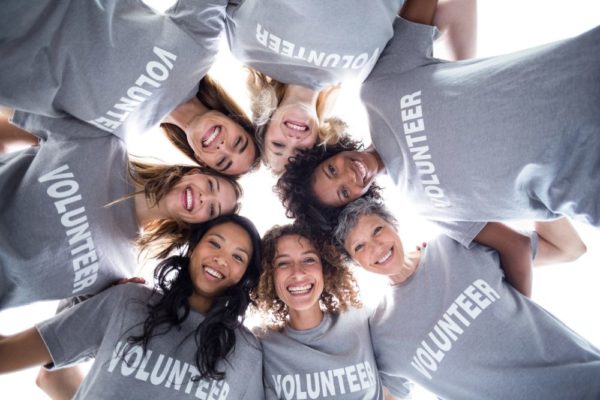 Team of volunteers in a huddle.