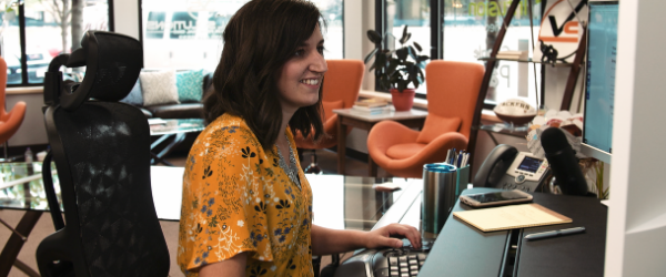 Woman working on insurance policies on computer