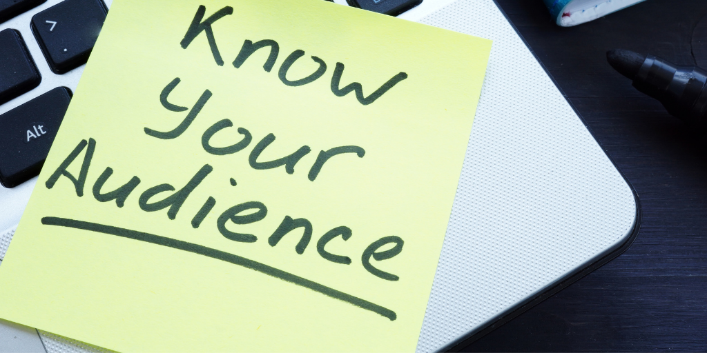 Yellow post-it that says "know your audience" relating your target audience for landing pages.