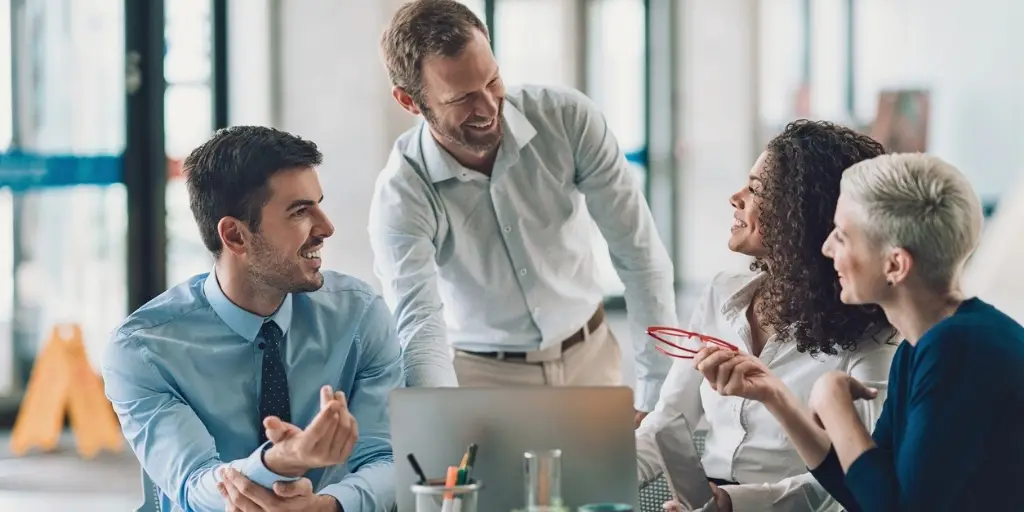 Group of male and female business owners having a meeting in an office.