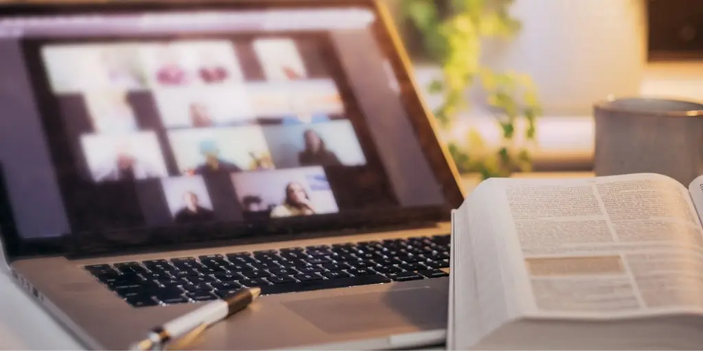 Online bible study during a church live stream seen through a laptop computer.