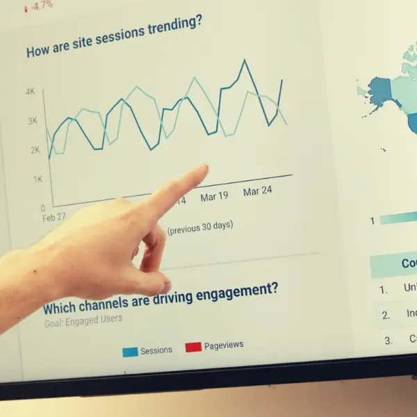 someone pointing at data during a presentation.