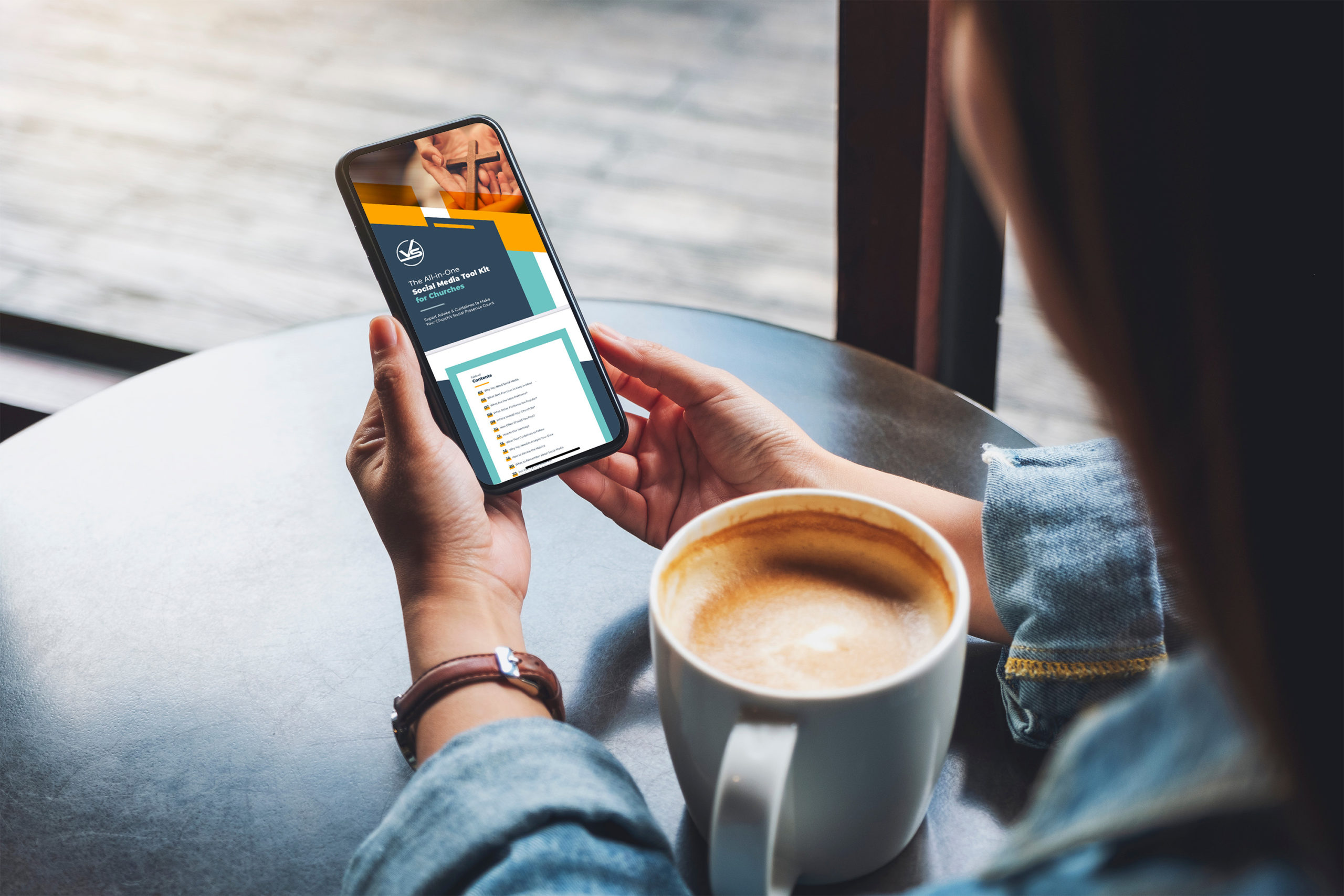 A woman at a coffee shop reading The All-in-One Social Media Tool Kit for Churches